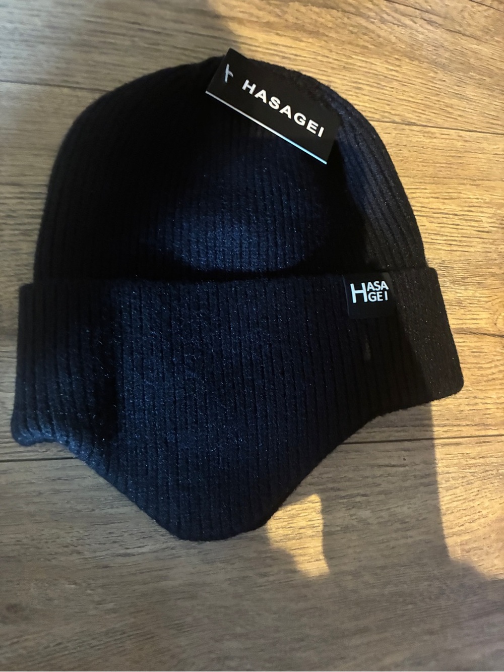 HASAGEI brand black cuffed beanie.